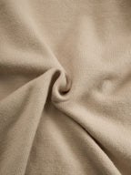 Draperad omlott-topp i taupe-stickat